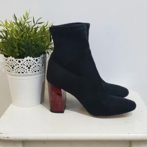 Chic Black Heeled Boots with Red Accent